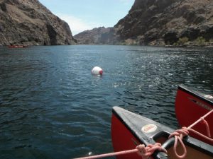 Tips of canoes on the water between mountains Lake Mead
