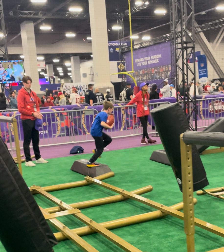 kid running at the Super Bowl Experience
